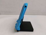 a small blue tablet on a black stand