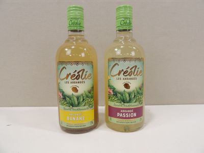 two bottles of celerie are sitting on a white table