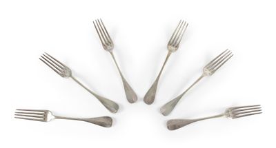 six fourchettes disposées en cercle sur une surface blanche