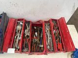 many tools in a red box on a table