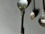 two spoons and a spoon spoon on a table