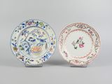 two chinese porcelain plates with flowers and birds on them