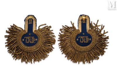 two pairs of blue and gold earrings with fringes on them