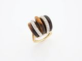 a close up of a ring on a white surface