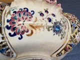 a white bowl with a floral design on it