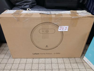 packaging for a new robotic vacuum cleaner in a store