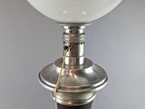 a lamp that is sitting on a table next to a cord
