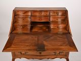an old wooden desk with drawers and drawers on top of it