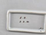 a close up of a white drawer with a label on it