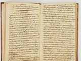 an open book with writing on it sitting on top of a table