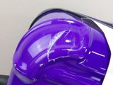 a purple and white vacuum that is sitting on the floor