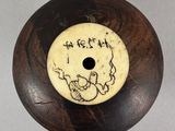 a picture of a wooden object with a drawing on it