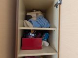 a small cabinet with a lot of items in it