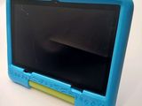 an image of a small blue tablet computer sitting on top of a table