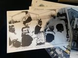 several old black and white photos of people on a table