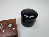 a wooden box with a puzzle on it next to a wooden box with a puzzle on it