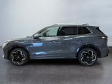 a grey 2020 honda pilot is parked in a garage
