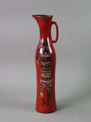 a red vase with a picture of a woman on it