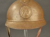 an old helmet with a lion head on the side of it