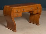 a wooden desk with drawers and a drawer underneath it