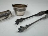 three spoons and a bowl sitting on a table