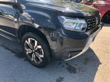 a picture of a black car parked in a parking lot