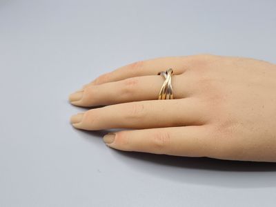 a close up of a person ' s hand with a ring on it
