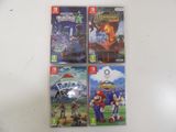 four nintendo wii games are on a table with a white background