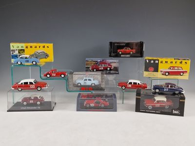 several different model cars are on display in a display case