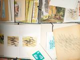 a lot of cards and postcards on a desk