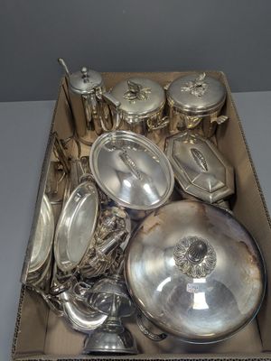 a box with a lot of silver items in it