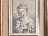 an old picture of a woman holding a bird in her hand