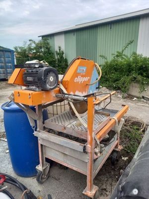 a machine that is sitting on a cart in the dirt