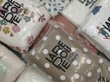 many bags of toilet paper sitting on the floor