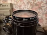 a camera lens sitting on top of a table next to a camera