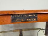 a glass display case with a sign on it that says henry roemer