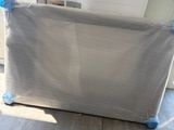 a baby crib that is on the floor in the room