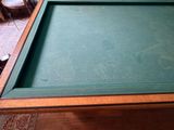 a pool table with a green cloth on it