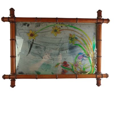 a picture of a painting on a mirror hanging on a wall