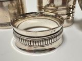 a silver plate and a silver cup on a table