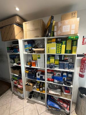 a room with a lot of boxes and boxes on the shelves