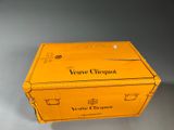 a yellow box that has a bottle of wine in it