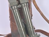 two metal poles that are next to a brown bag