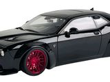 black dodge charger with red rims on a white background
