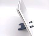 a white tablet computer sitting on top of a desk