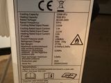 a label on the side of a refrigerator that says portable air conditioner