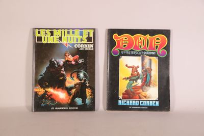 two comics are sitting on a table next to each other