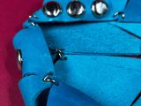 a close up of a pair of scissors on a piece of cloth