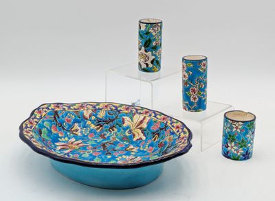 a blue bowl and four cups sitting on a table