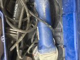a blue tool in a blue box on the floor